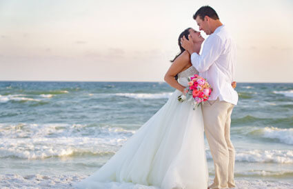 bride and groom on beach