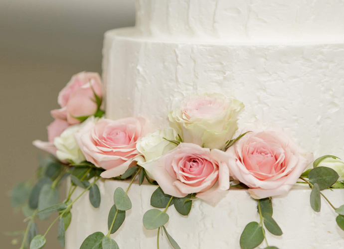 wedding cake decorated with roses