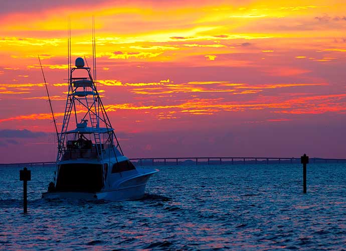 boat at sunset on the water