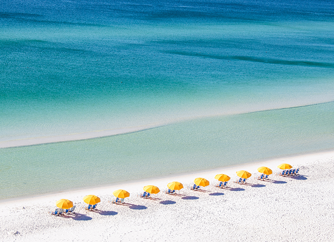 Yellow umbrellas at a private resort beach in florida