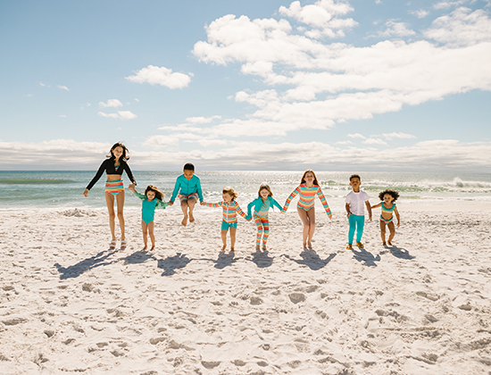 kids playing on the beach at Hilton