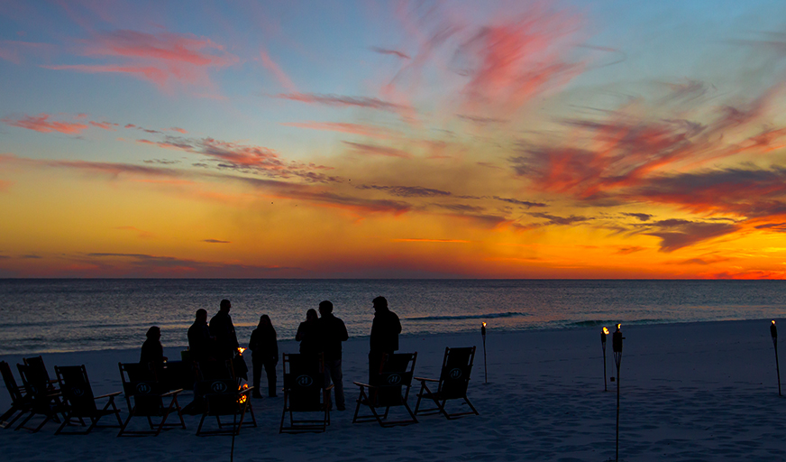 Group nightime firepit on beach