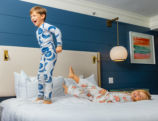 kids playing on bed