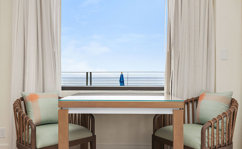 Small table and chairs in a suite at one of Hilton's Destin, Hotels