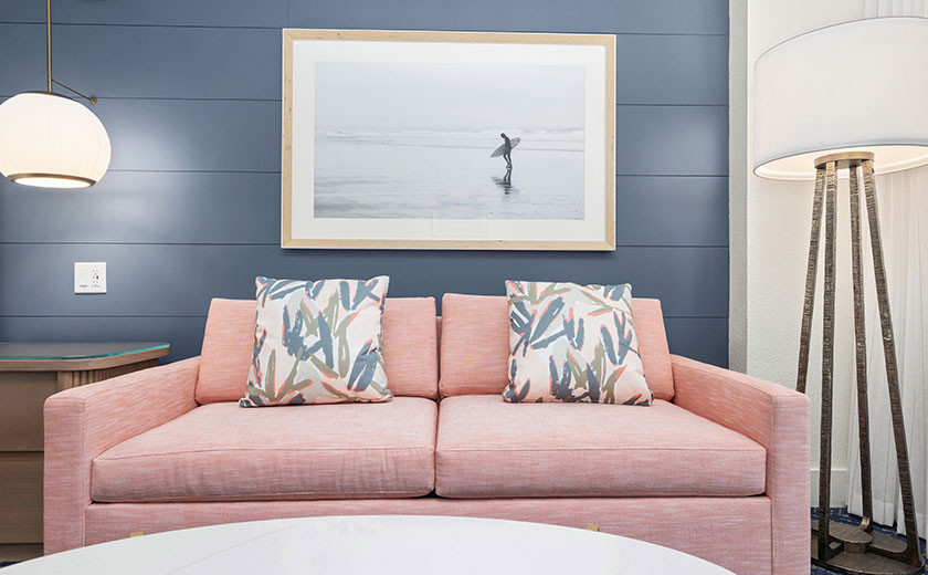 Pink couch in a Destin hotel room