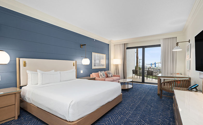 King bedroom with a walkout deck overlooking the beach in Destin, Florida