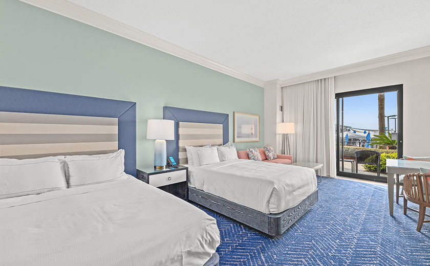 Two queen beds in a coastal inspired gues room at Hilton in Destin, FL.