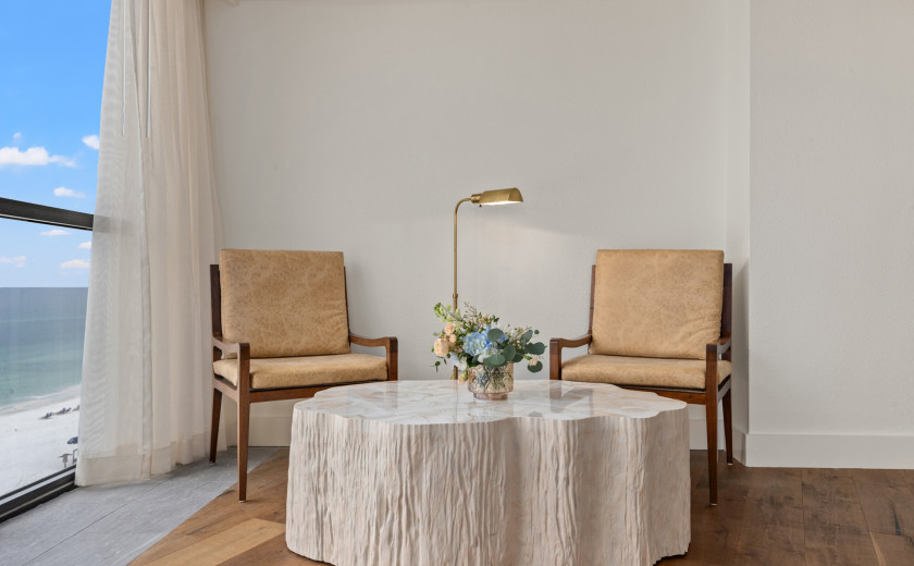 Mcm chairs tucked near a wood coffee table