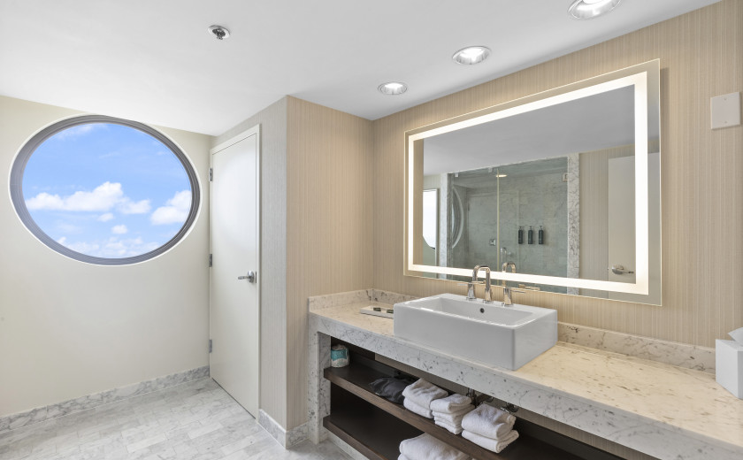 Spacious bathroom in a hotel room.