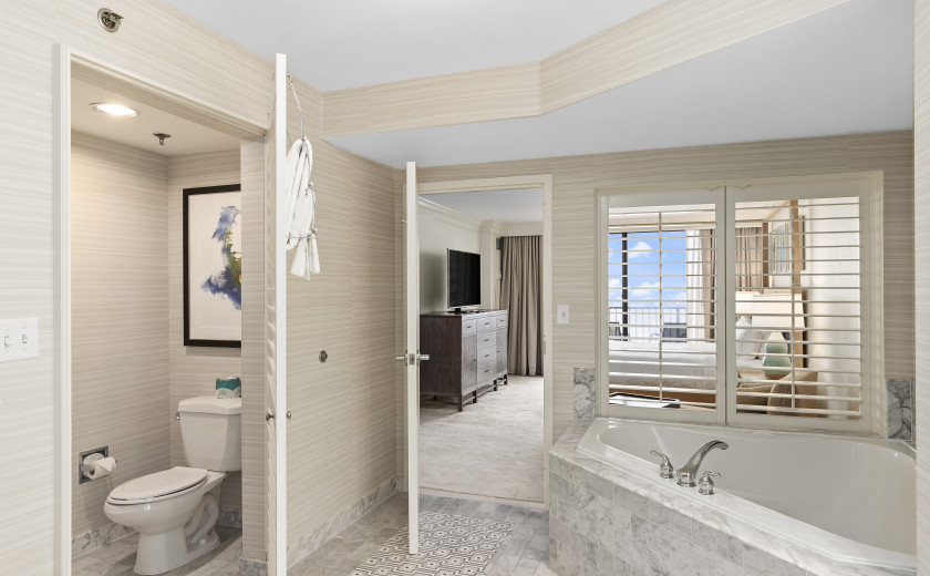 Ensuite master bathroom with a jacuzzi