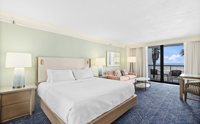 Florida resort hotel room with a couch and coffee table.